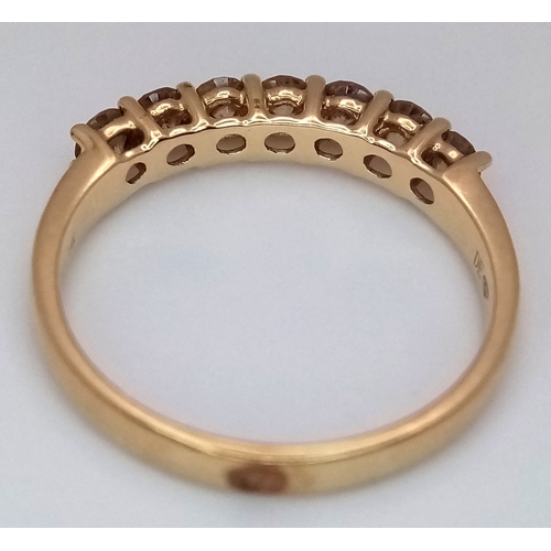 156 - A 14K Yellow Gold Seven Stone Diamond Ring. 0.66ctw of round brilliant cut tinted diamonds with SI2 ... 