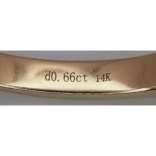 156 - A 14K Yellow Gold Seven Stone Diamond Ring. 0.66ctw of round brilliant cut tinted diamonds with SI2 ... 