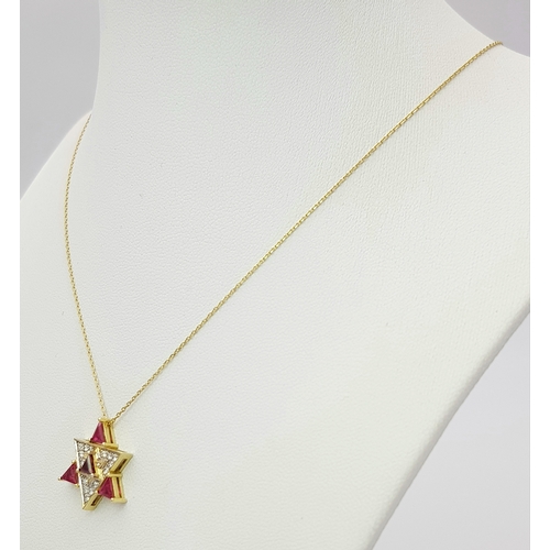 184 - A 14K Gold Ruby and Diamond Fancy Star of David Pendant on a 14K Gold Necklace. 0.51ctw of diamonds.... 