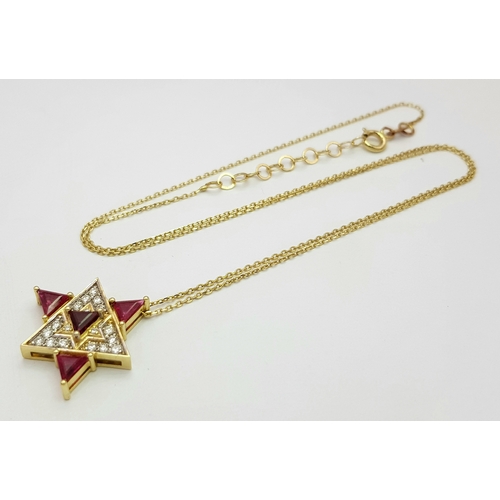 184 - A 14K Gold Ruby and Diamond Fancy Star of David Pendant on a 14K Gold Necklace. 0.51ctw of diamonds.... 