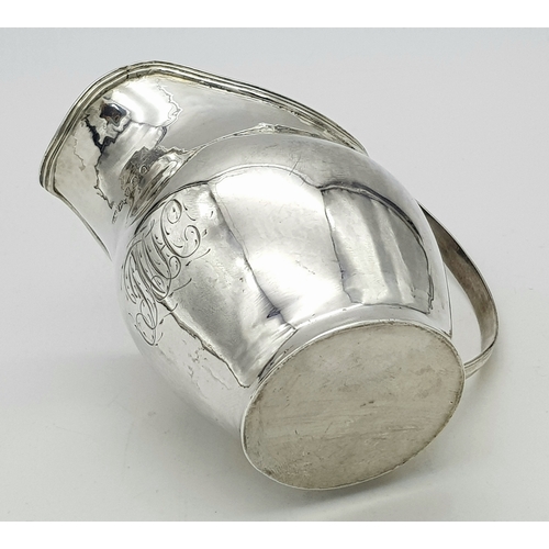 236 - AN ANTIQUE EARLY GEORGIAN SILVER CREAMER (CIRCA 1724).    99.6gms