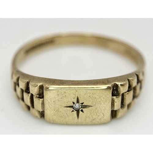 243 - A 9K GOLD RING WITH SMALL DIAMOND .     2.3gms    size T