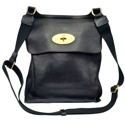 387 - A Mulberry Antony Black Leather Messenger Bag. Grained leather exterior with brass-toned hardware, a... 