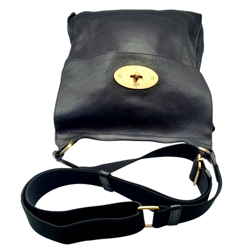 387 - A Mulberry Antony Black Leather Messenger Bag. Grained leather exterior with brass-toned hardware, a... 