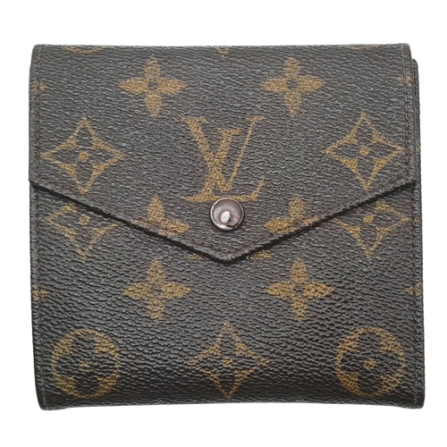 409 - A Louis Vuitton Monogram Canvas Wallet. Brown monogram canvas exterior with a press-stud closure. Do... 