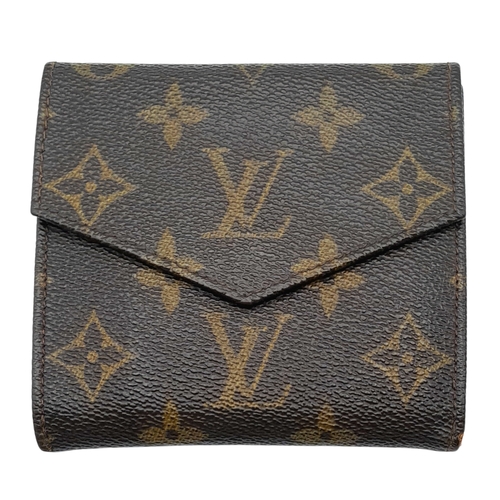 409 - A Louis Vuitton Monogram Canvas Wallet. Brown monogram canvas exterior with a press-stud closure. Do... 
