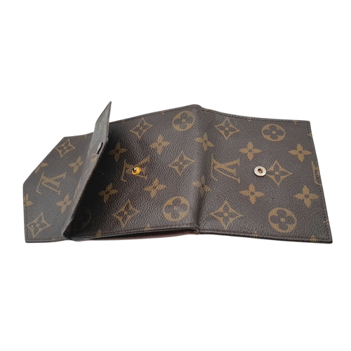 409 - A Louis Vuitton Monogram Canvas Wallet. Brown monogram canvas exterior with a press-stud closure. Do... 
