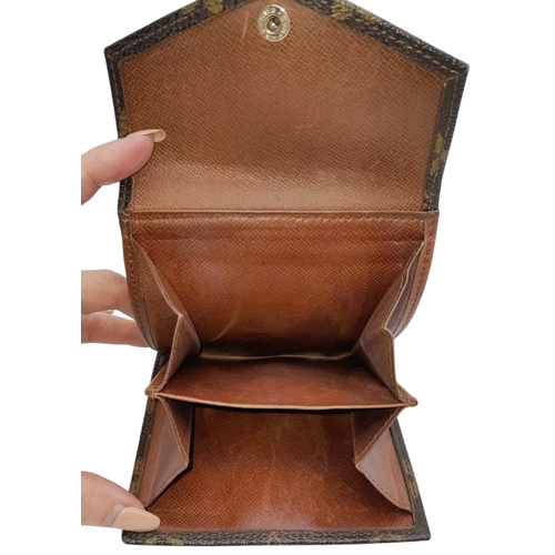 409 - A Louis Vuitton Monogram Canvas Wallet. Brown monogram canvas exterior with a press-stud closure. Do... 