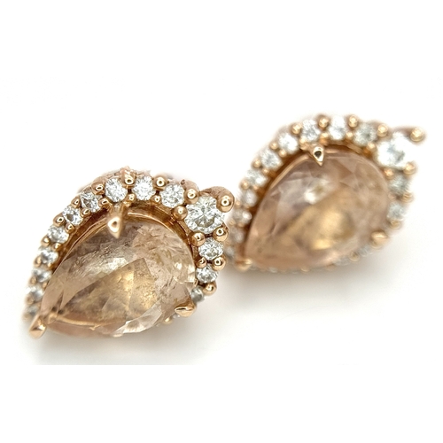 128 - A Pair of 14K Rose Gold Citrine and Diamond Stud Earrings - Both having a 2ct pear cut citrine with ... 