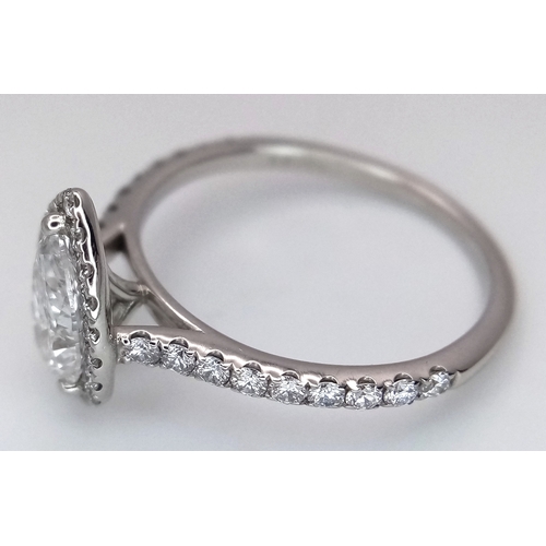 191 - A Platinum and Lab Diamond Dress Ring. 1ct pear brilliant cut diamond having D colour with VS2 clari... 