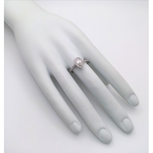 191 - A Platinum and Lab Diamond Dress Ring. 1ct pear brilliant cut diamond having D colour with VS2 clari... 