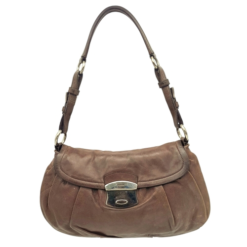 366 - A Prada Hobo Shoulder Bag. Crafted in brown grained leather with silver-tone hardware and an adjusta... 