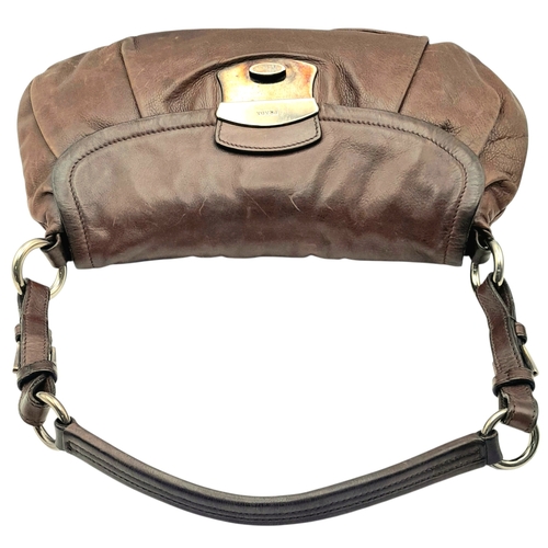 366 - A Prada Hobo Shoulder Bag. Crafted in brown grained leather with silver-tone hardware and an adjusta... 