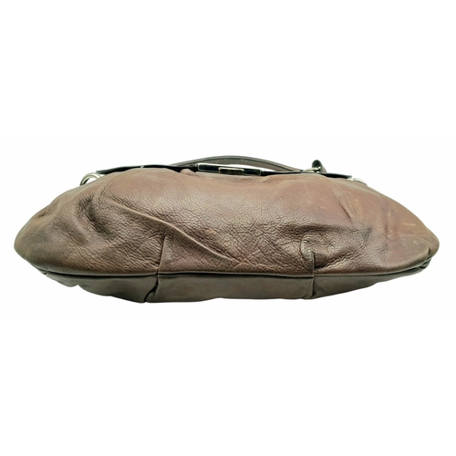 366 - A Prada Hobo Shoulder Bag. Crafted in brown grained leather with silver-tone hardware and an adjusta... 