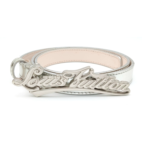 380 - A Louis Vuitton Silver Cursive Script Belt, featuring a metallic monogram buckle. Approximately 93.5... 