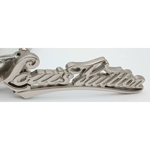 380 - A Louis Vuitton Silver Cursive Script Belt, featuring a metallic monogram buckle. Approximately 93.5... 