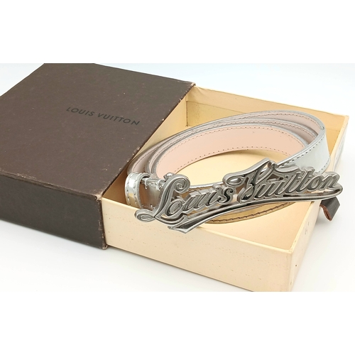 380 - A Louis Vuitton Silver Cursive Script Belt, featuring a metallic monogram buckle. Approximately 93.5... 