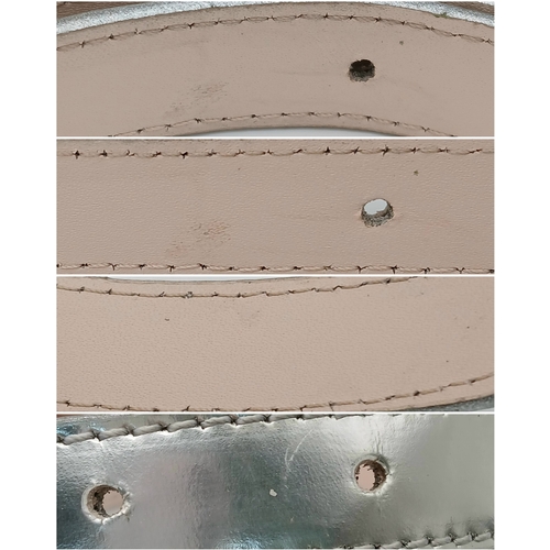 380 - A Louis Vuitton Silver Cursive Script Belt, featuring a metallic monogram buckle. Approximately 93.5... 