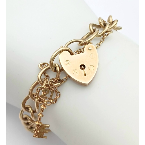 4 - A VINTAGE 9K GOLD BRACELET WITH A HEART SHAPED PADLOCK AND DANGLING KEY CHARM .      16.2gms     19c... 