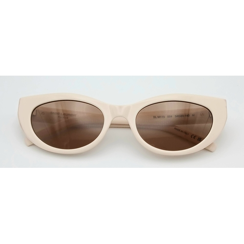 416 - A Pair of Saint Laurent SL M115 Sunglasses in Ivory with Brown Tinted Lenses. Comes with case and bo... 