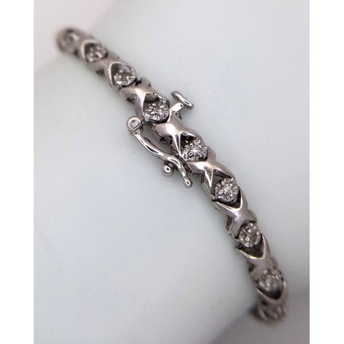 198 - A 9k white gold diamond set bracelet, 0.15ct diamond weight, 6.2g total weight, 18cm total length. R... 