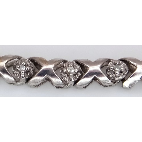 198 - A 9k white gold diamond set bracelet, 0.15ct diamond weight, 6.2g total weight, 18cm total length. R... 
