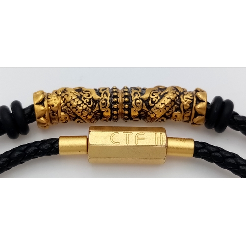179 - A Lao Miao 24K Gold nugget charm Braided Bracelet. Black braided cord with 24K gold decorative barre... 