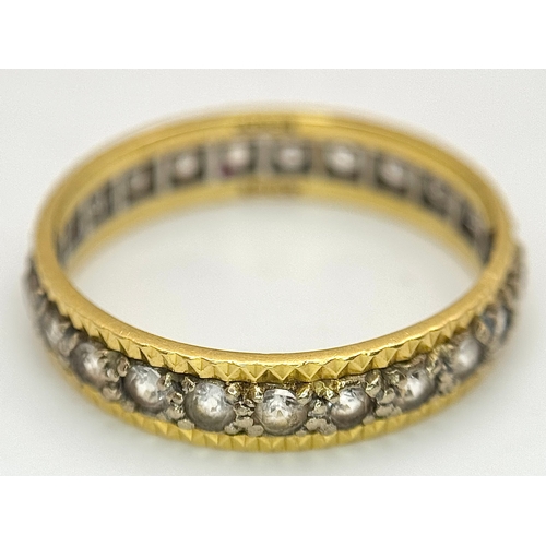 291 - AN 18K GOLD AND DIAMOND FULL ETERNITY RING .     3.4gms        size S