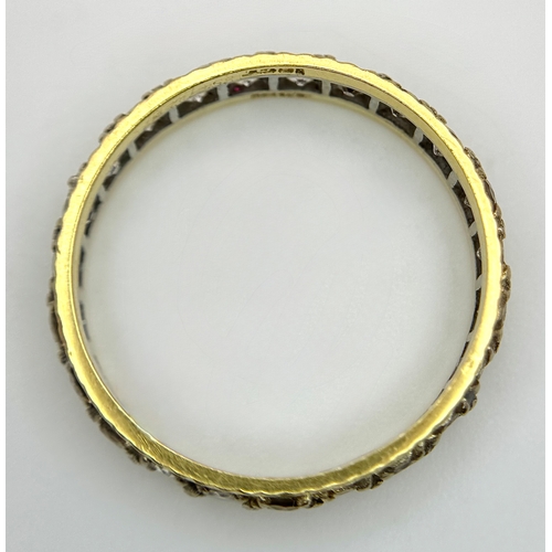 291 - AN 18K GOLD AND DIAMOND FULL ETERNITY RING .     3.4gms        size S