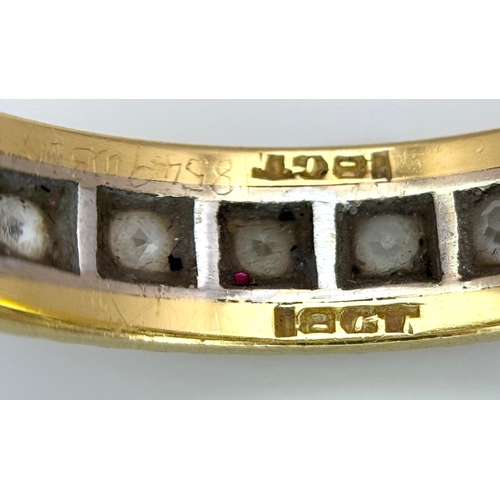 291 - AN 18K GOLD AND DIAMOND FULL ETERNITY RING .     3.4gms        size S