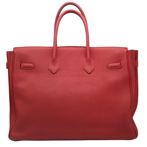 60 - A Red Hermès Birkin 35 Handbag. Red leather exterior with silver-toned hardware, dual rolled leather... 