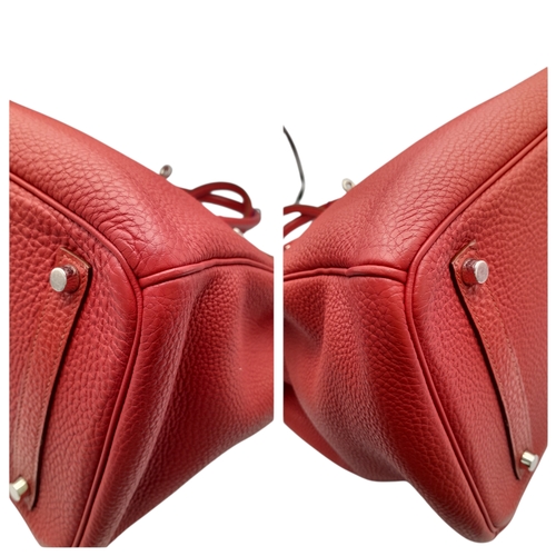 60 - A Red Hermès Birkin 35 Handbag. Red leather exterior with silver-toned hardware, dual rolled leather... 
