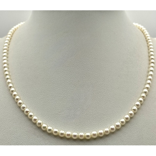 482 - A Platinum and Cultured Pearl Necklace. 2/3mm pearls. 38cm length. 9.3g. MT11.