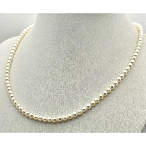 482 - A Platinum and Cultured Pearl Necklace. 2/3mm pearls. 38cm length. 9.3g. MT11.