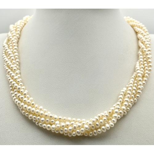 489 - A Silver and Six Strand Freshwater Pearl Necklace. 40cm. 43g. MT10.