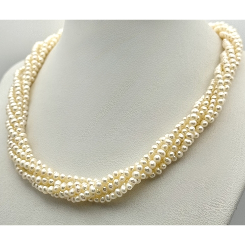 489 - A Silver and Six Strand Freshwater Pearl Necklace. 40cm. 43g. MT10.