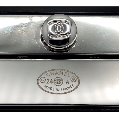 125 - A Chanel Black CC Embellished Cuff Bangle. Set with white stones. 5.5cm width. 58mm inner diameter. ... 