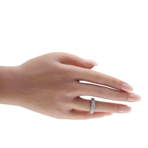 122 - A Cartier Mimi 18K White Gold Diamond Ring. The curved 18K White Gold setting beautifully showcases ... 
