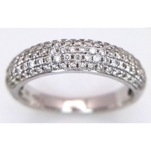 An 18K White Gold Diamond Pave Ring. Size J 1/2. 3.53g. Two small ...