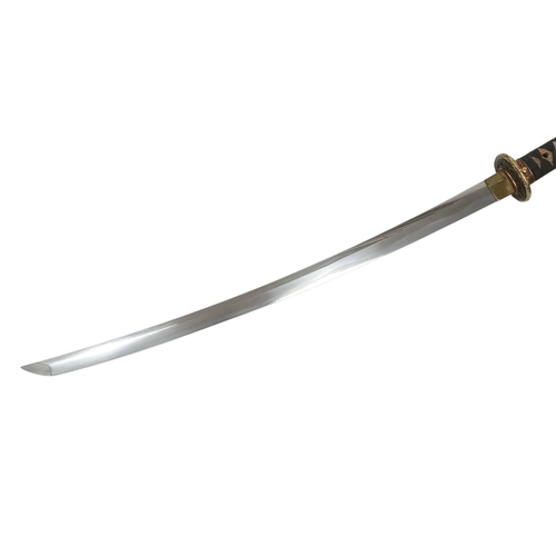 15 - WW2 Japanese Officers Katana Sword. Complete with knot and leather scabbard cover. Brought back from... 