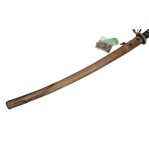15 - WW2 Japanese Officers Katana Sword. Complete with knot and leather scabbard cover. Brought back from... 