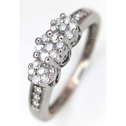 495 - A 9K WHITE GOLD, DIAMOND SET, TRIPLE CLUSTER RING. 0.25 CTW, 2.1G, SIZE J. SC 7038