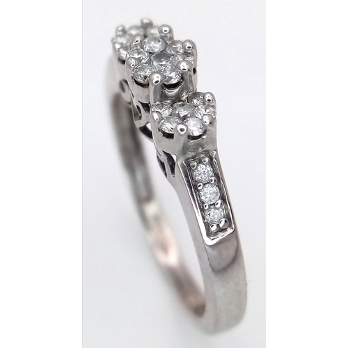 495 - A 9K WHITE GOLD, DIAMOND SET, TRIPLE CLUSTER RING. 0.25 CTW, 2.1G, SIZE J. SC 7038