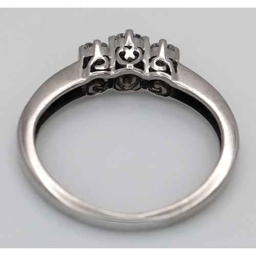 495 - A 9K WHITE GOLD, DIAMOND SET, TRIPLE CLUSTER RING. 0.25 CTW, 2.1G, SIZE J. SC 7038