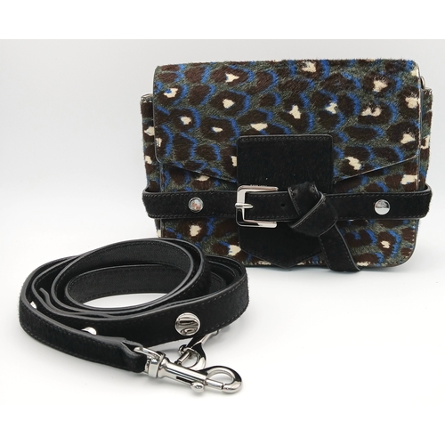 491 - A Jimmy Choo Leopard Print Clutch/Shoulder Bag. Pony hair exterior with silver-toned hardware and ma... 