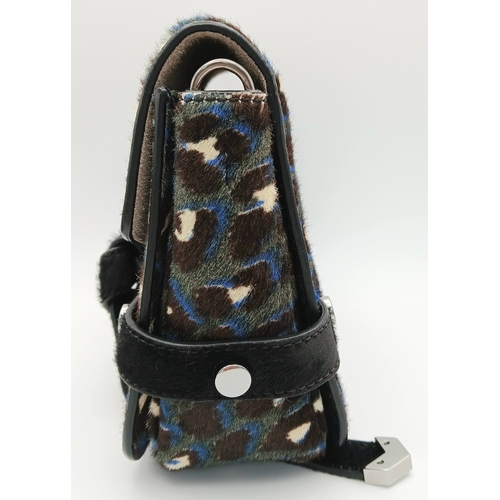 491 - A Jimmy Choo Leopard Print Clutch/Shoulder Bag. Pony hair exterior with silver-toned hardware and ma... 