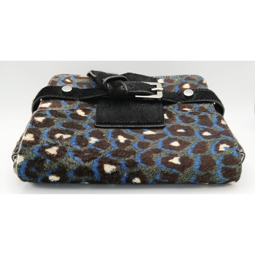 491 - A Jimmy Choo Leopard Print Clutch/Shoulder Bag. Pony hair exterior with silver-toned hardware and ma... 