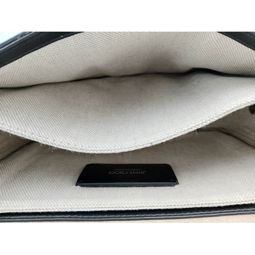 491 - A Jimmy Choo Leopard Print Clutch/Shoulder Bag. Pony hair exterior with silver-toned hardware and ma... 