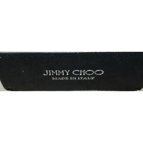 491 - A Jimmy Choo Leopard Print Clutch/Shoulder Bag. Pony hair exterior with silver-toned hardware and ma... 