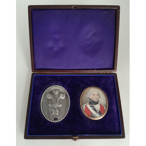 A Cased Waterloo and Peninsular Officers Shoulder Belt Plate and Miniature Portrait. Attributed to Lieutenant Gismond Phillips of the 23rd Regiment of Foot. The belt plate is hallmarked London 1805 - The miniature shows him wearing this. Some decorative beading has come loose at the reverse of the portrait which also bears sweetheart initials. Comes in a fitted case.